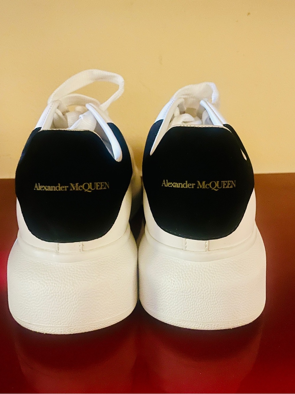 Alexander McQueen White Leather Sneakers with Black Heel Tab and Gold Logo